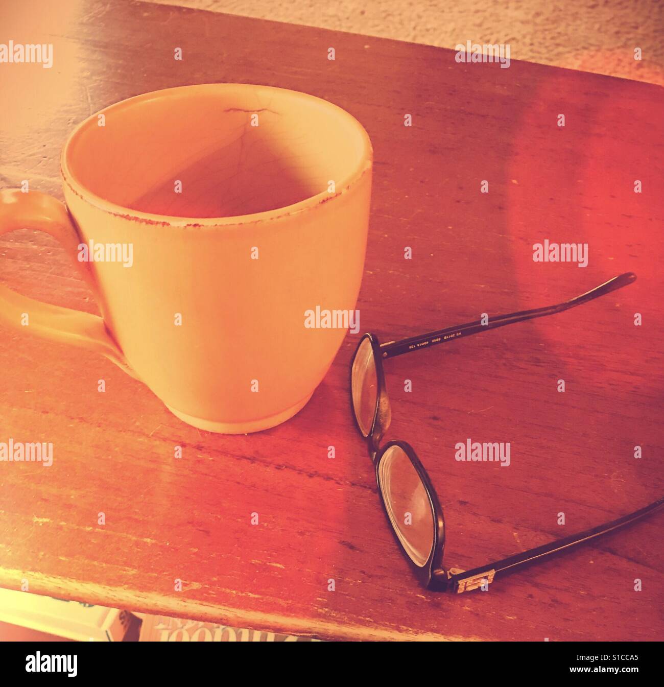 Coffee Mug and Glasses on Table Stock Photo