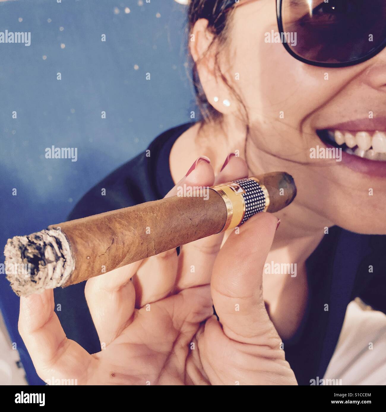Woman and cigar - Smartphone Captured Stock Image