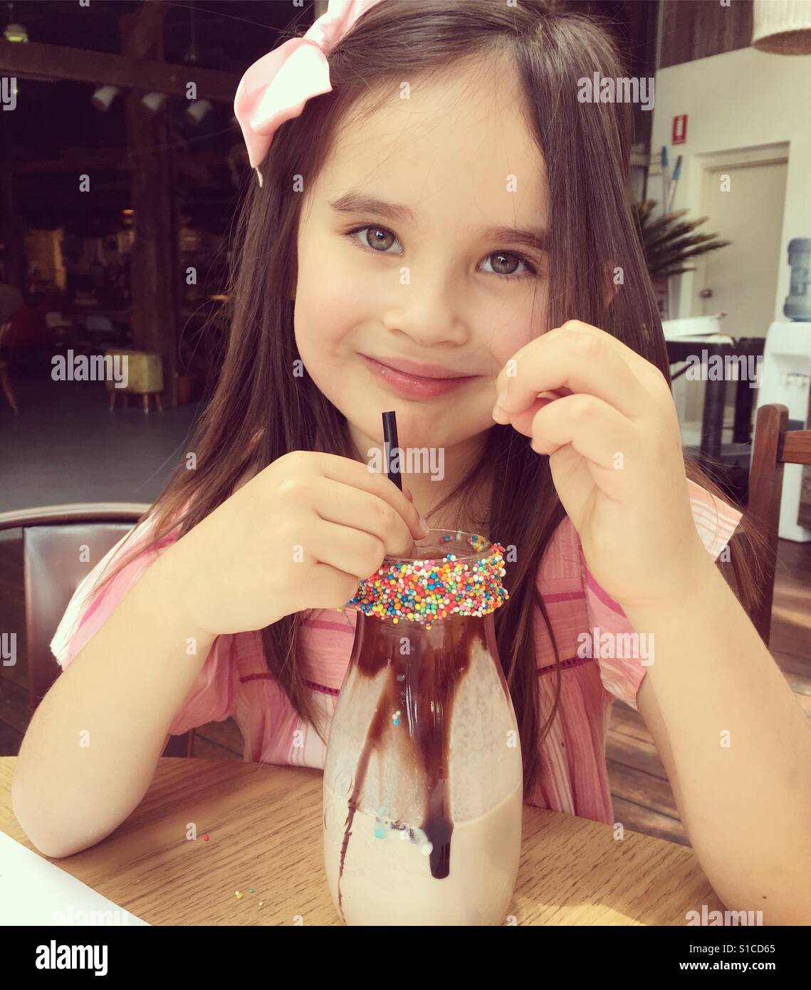 Young girl with milkshake Stock Photo