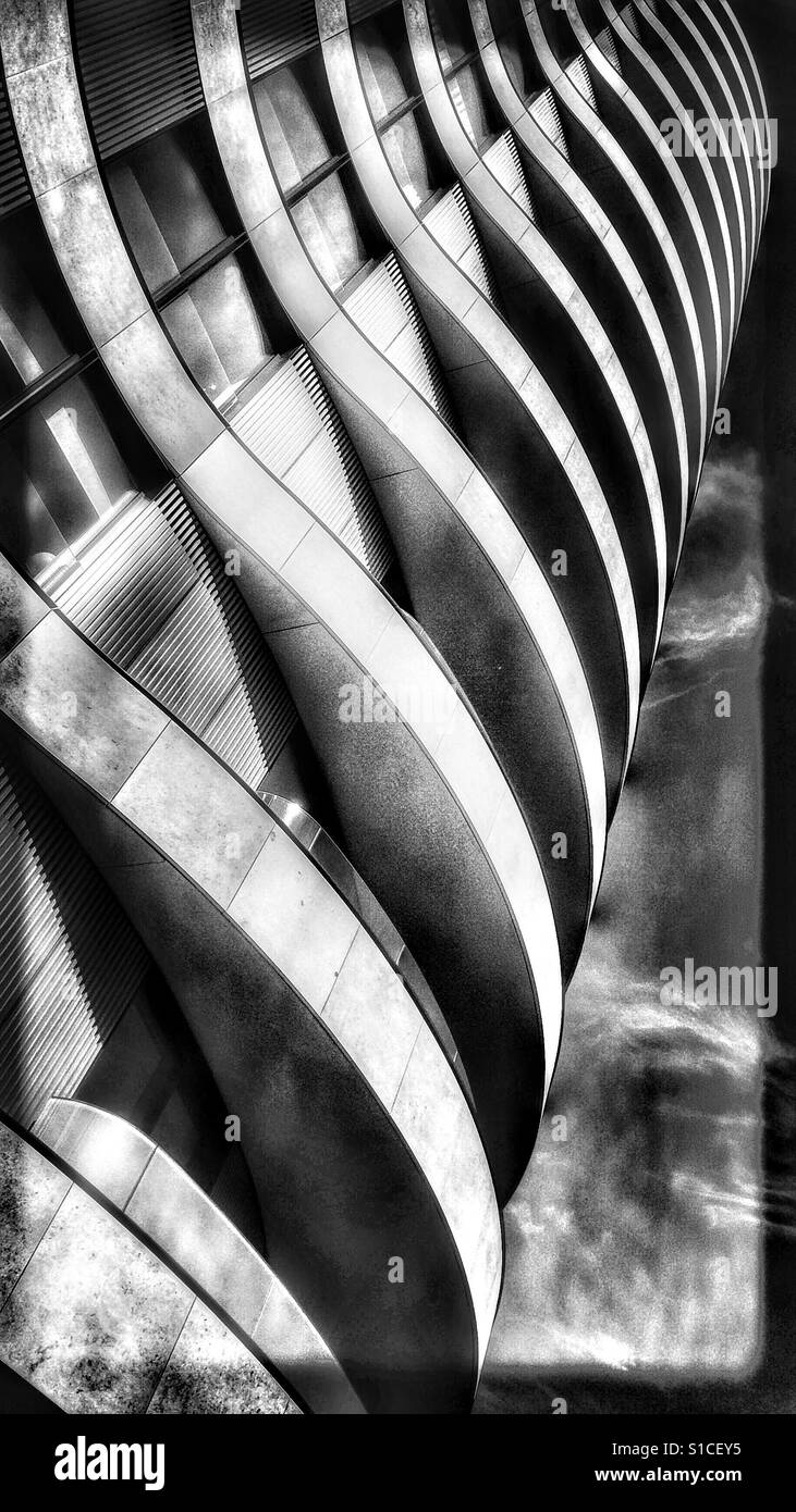 Curved futuristic apartment high rise from below, London - Smartphone Captured Stock Image