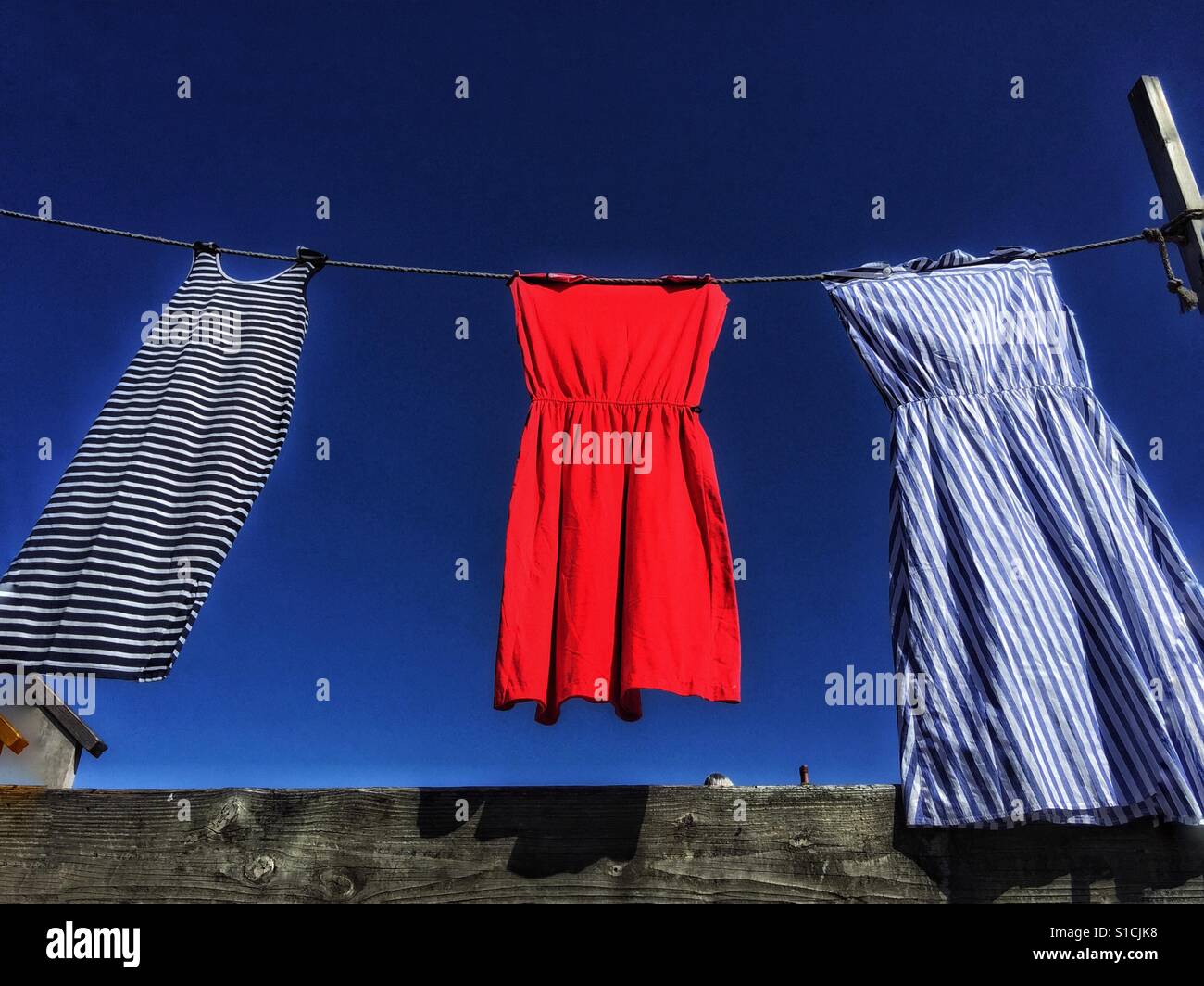 Colourful dresses on a clothes line. - Smartphone Captured Stock Image