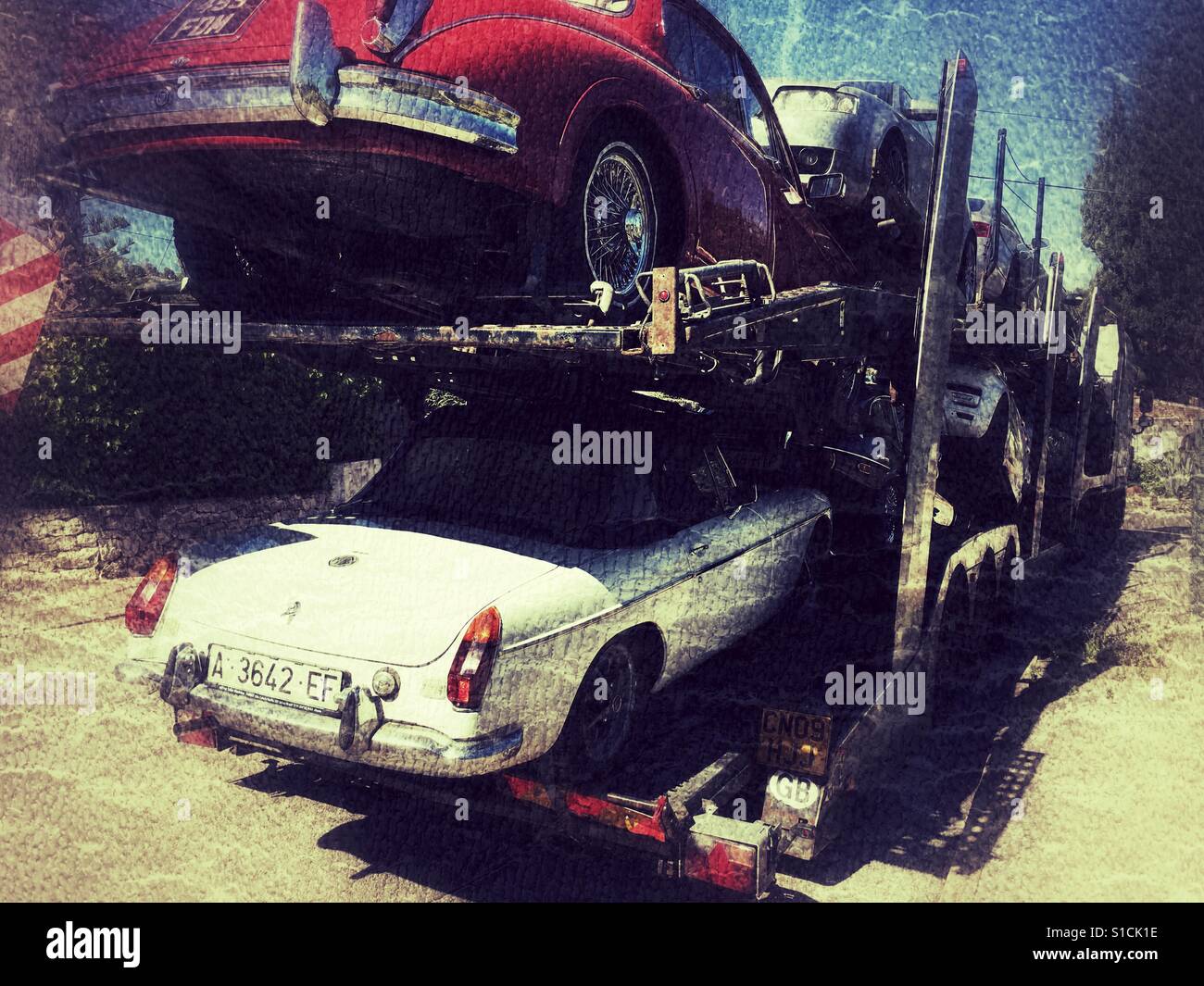 Spanish registered MGB Roadster on an English car transporter - Smartphone Captured Stock Image