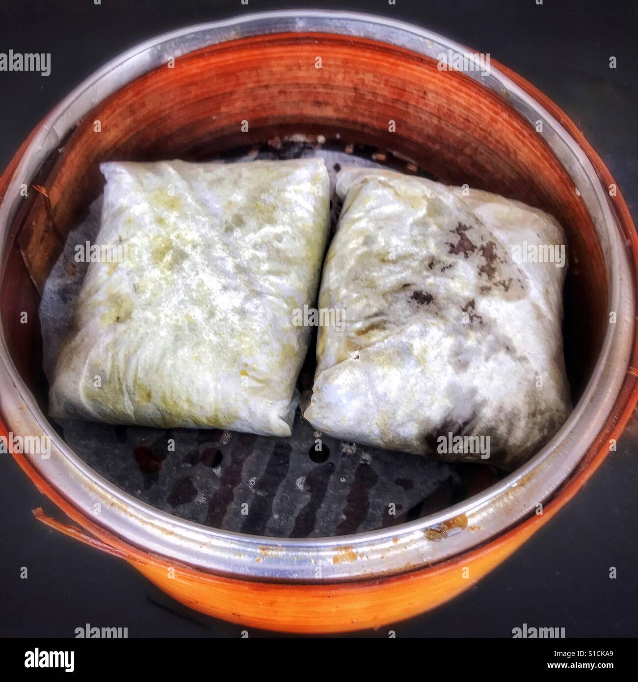 Dim sum sticky rice wrapped in lotus leaf Stock Photo Alamy