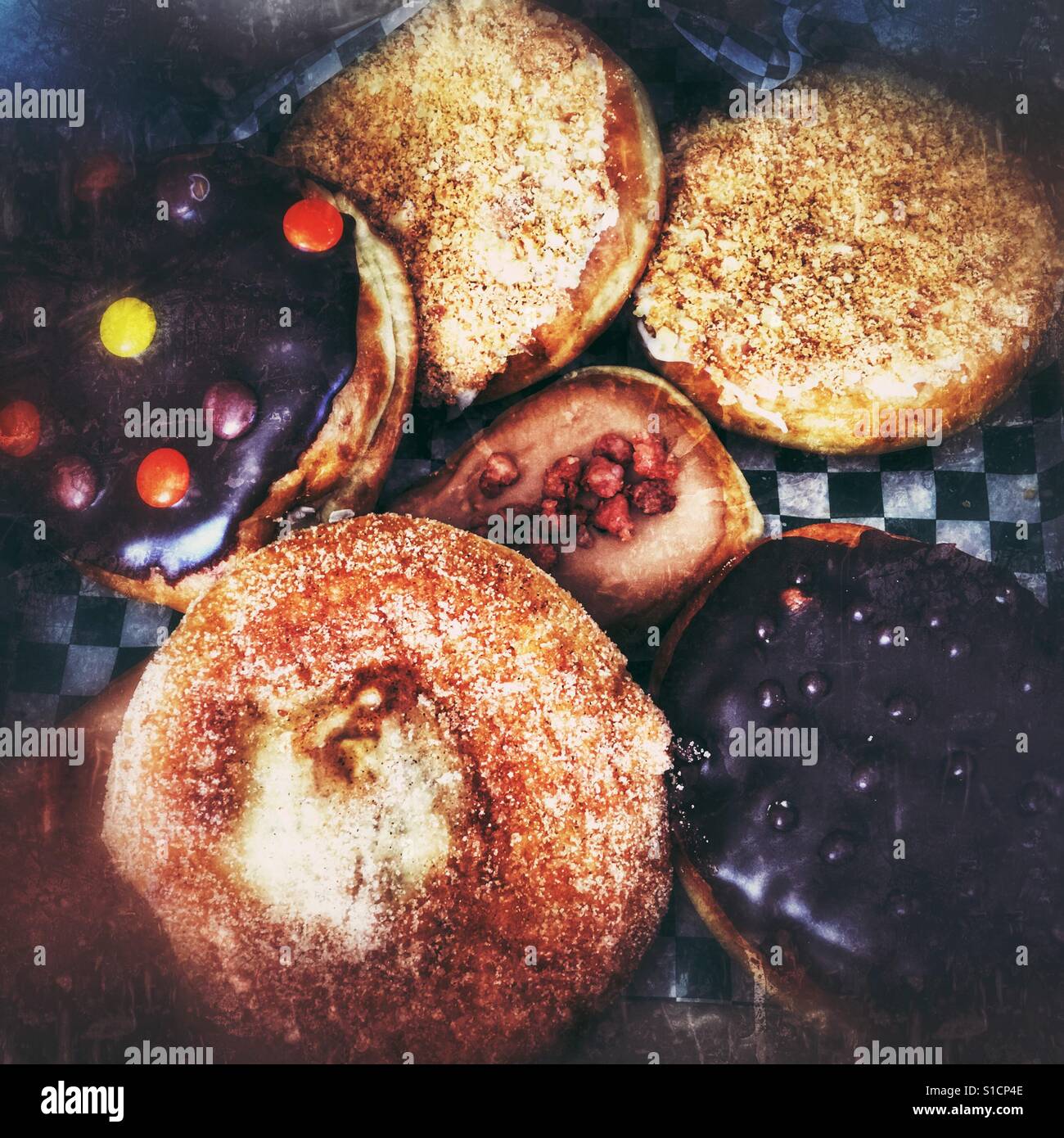Assortment doughnuts in a box. Blurred edges. Stock Photo