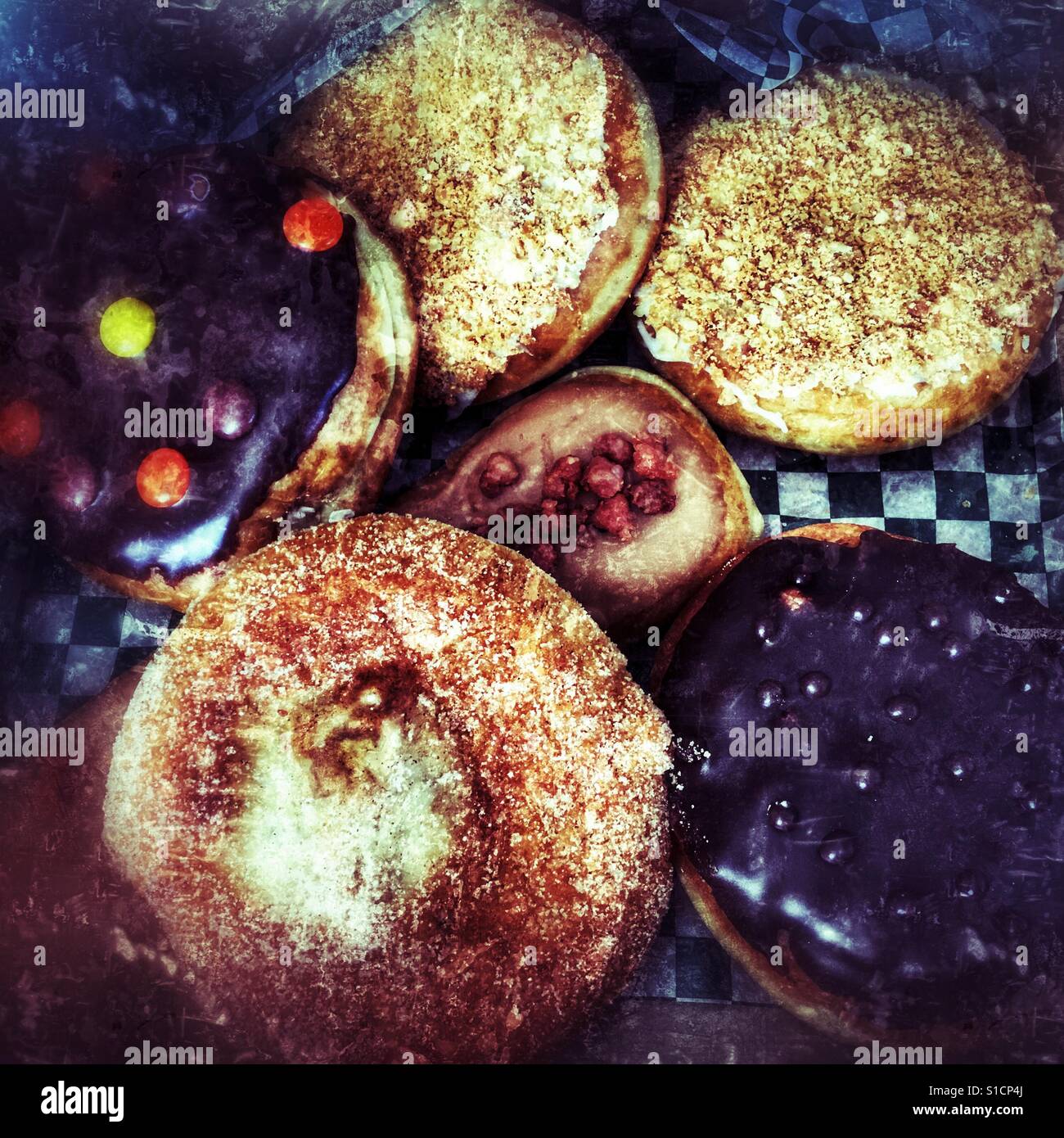 Assortment of sweet sugary doughnuts. - Smartphone Captured Stock Image