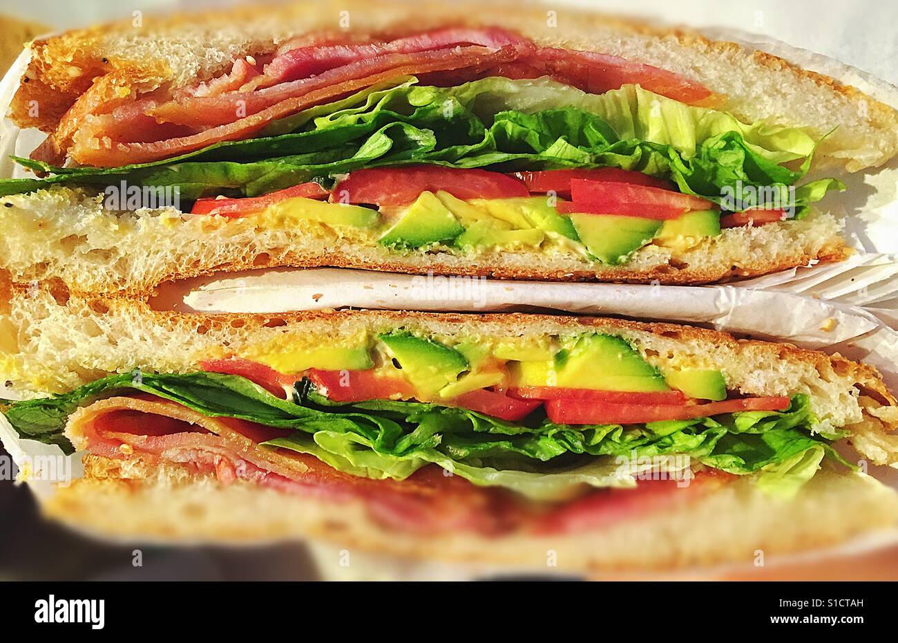 Classic bacon, lettuce, tomato and avocado sandwich Stock Photo Alamy