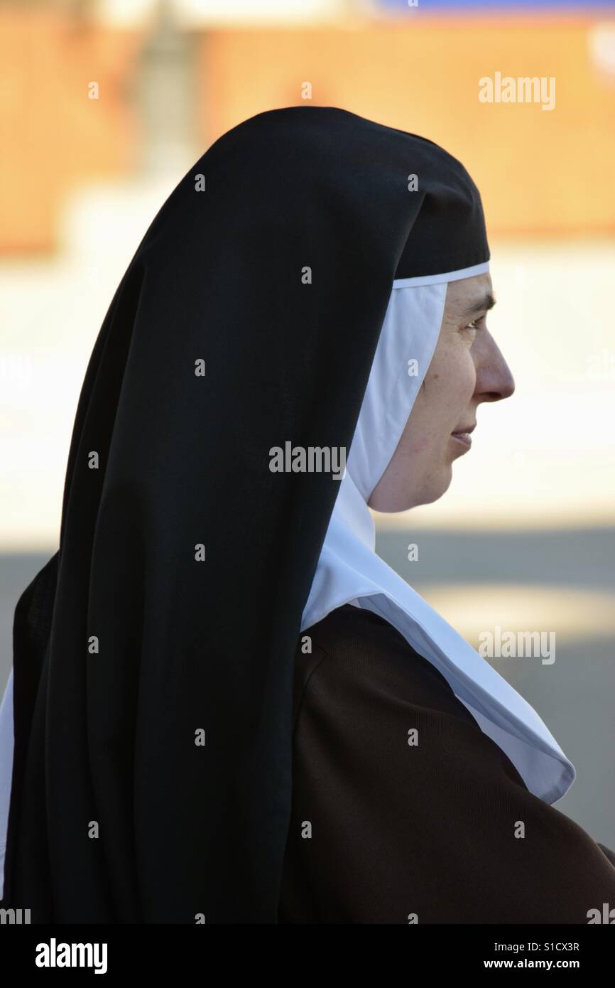 Nun in thought - Smartphone Captured Stock Image