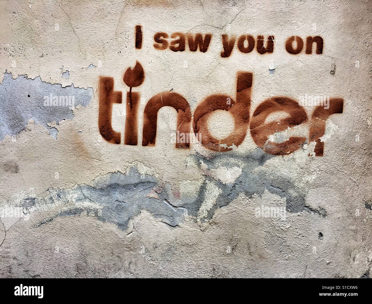 Tinder graffiti on a wall Stock Photo