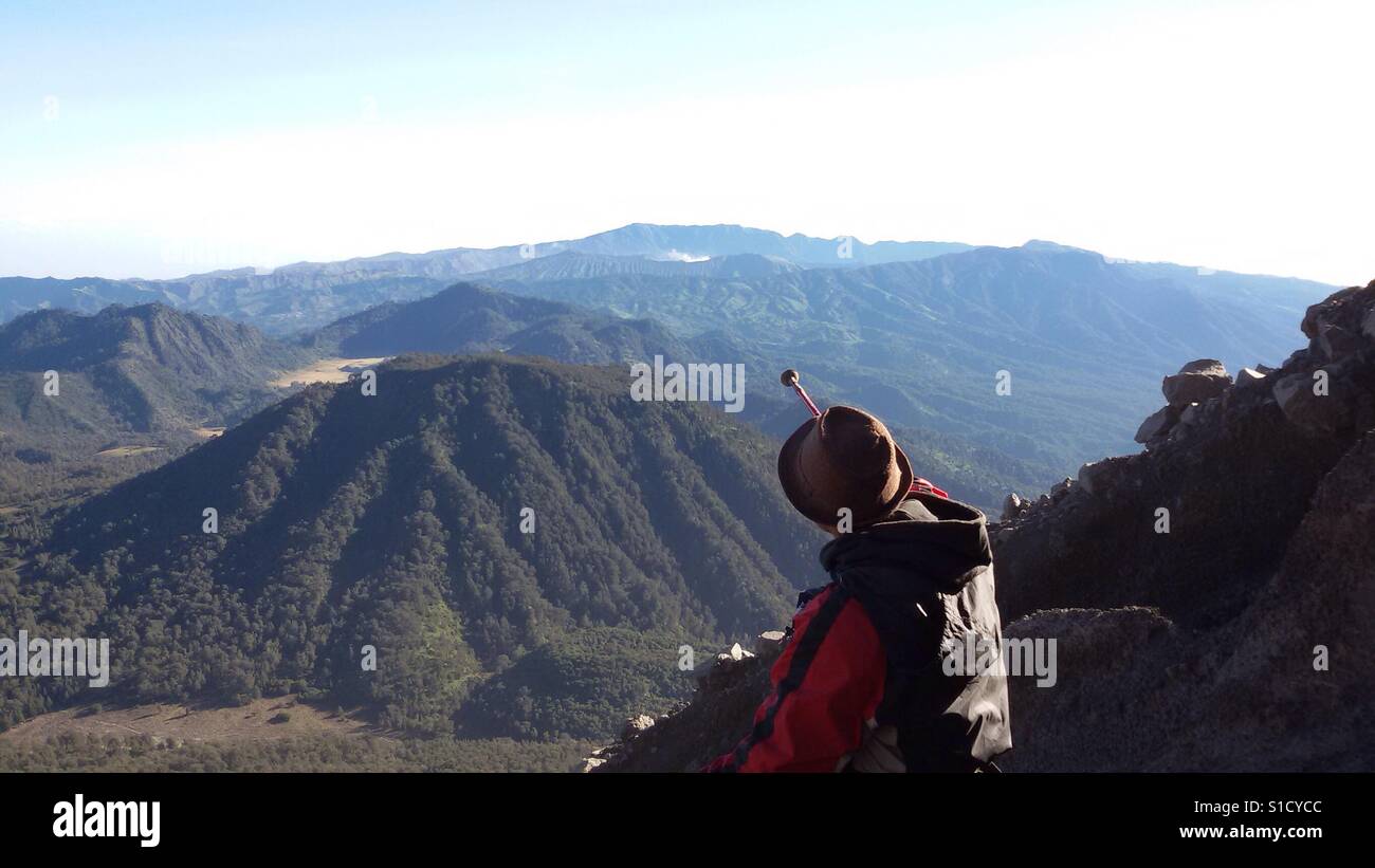 Aiming Bromo Mountain with Hiking Pole From Semeru Mountain Stock Photo