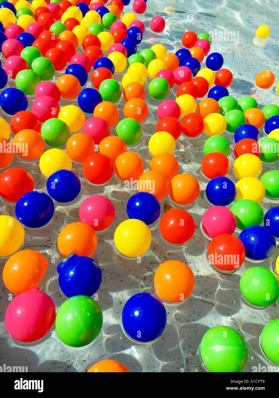Balls floating in water Stock Photo Alamy