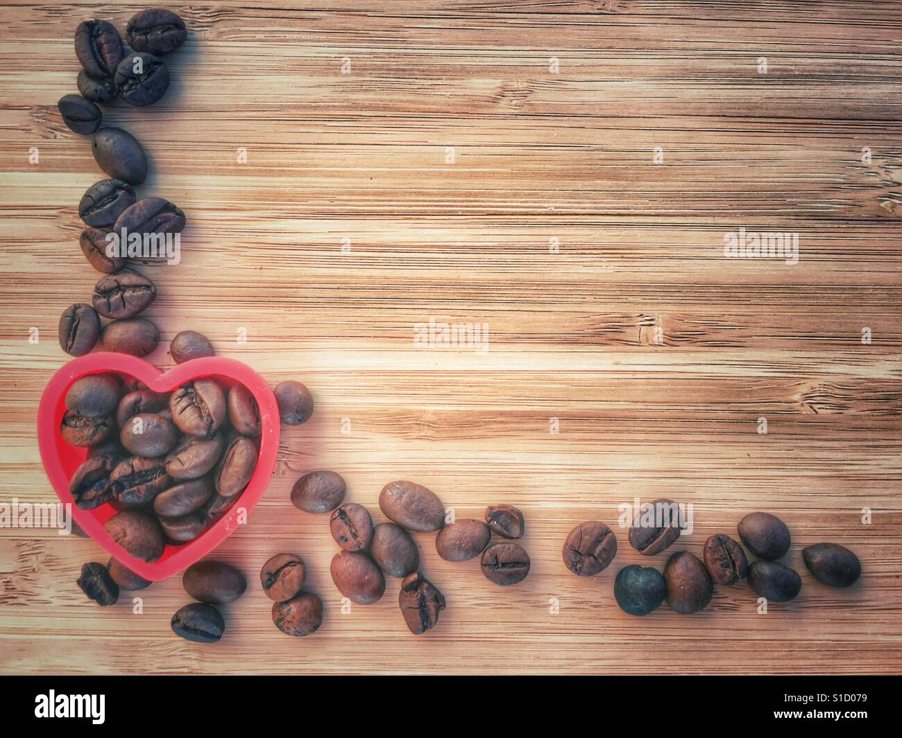 Coffee beans in a red heart - Smartphone Captured Stock Image