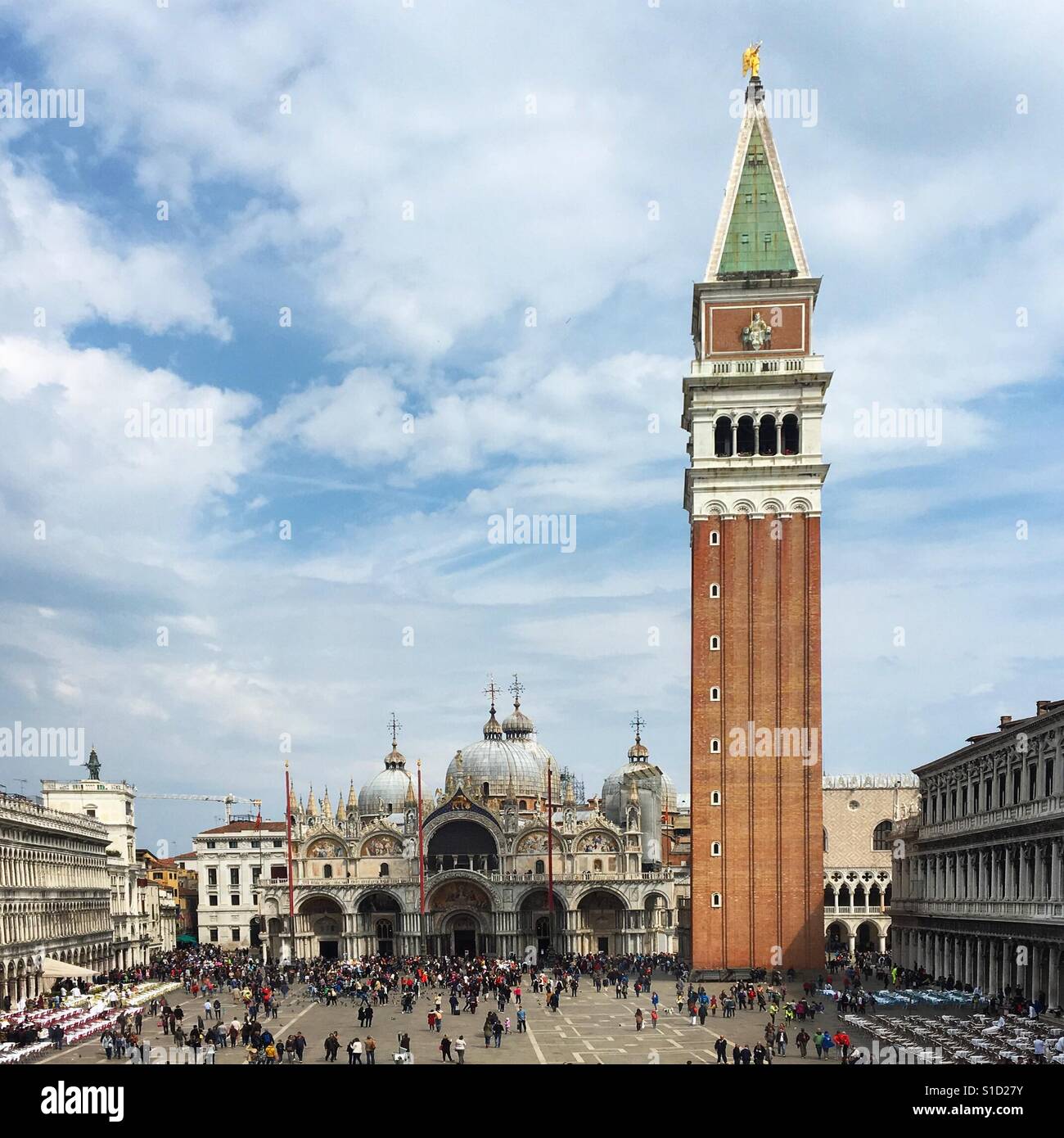 St Mark's Square, Venice, filled with tourists on a sunny spring day - Smartphone Captured Stock Image