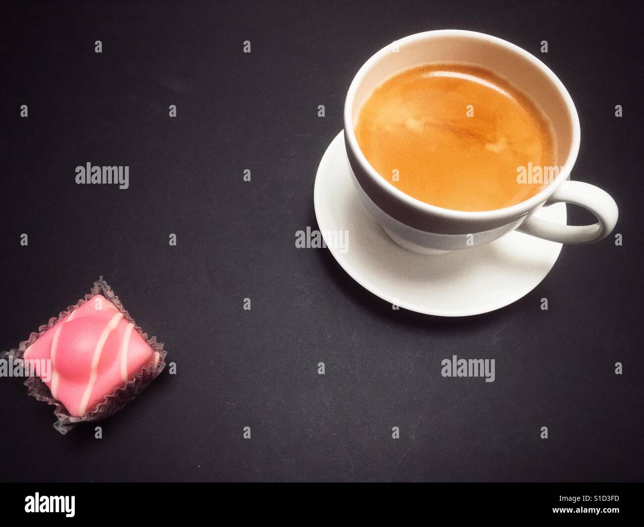 Espresso coffee and Mr Kipling French Fancies Stock Photo