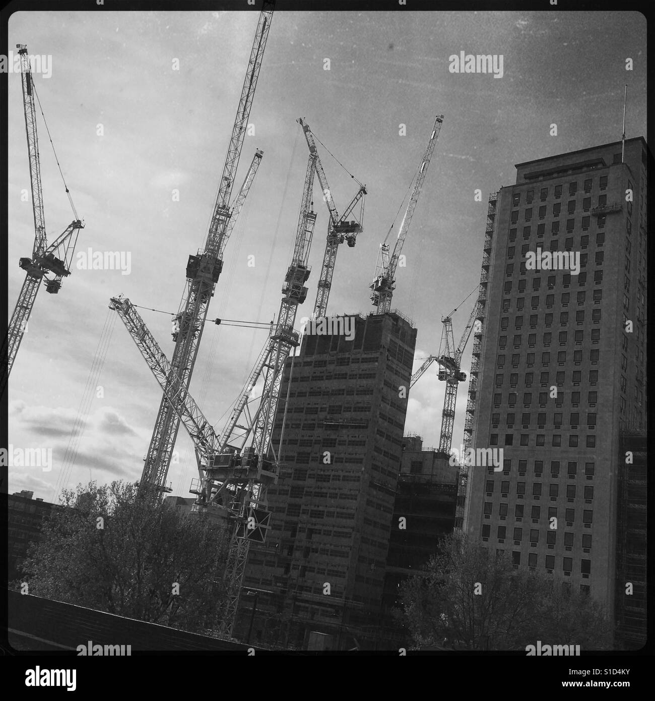 Tall building cranes Black and White Stock Photos & Images - Alamy