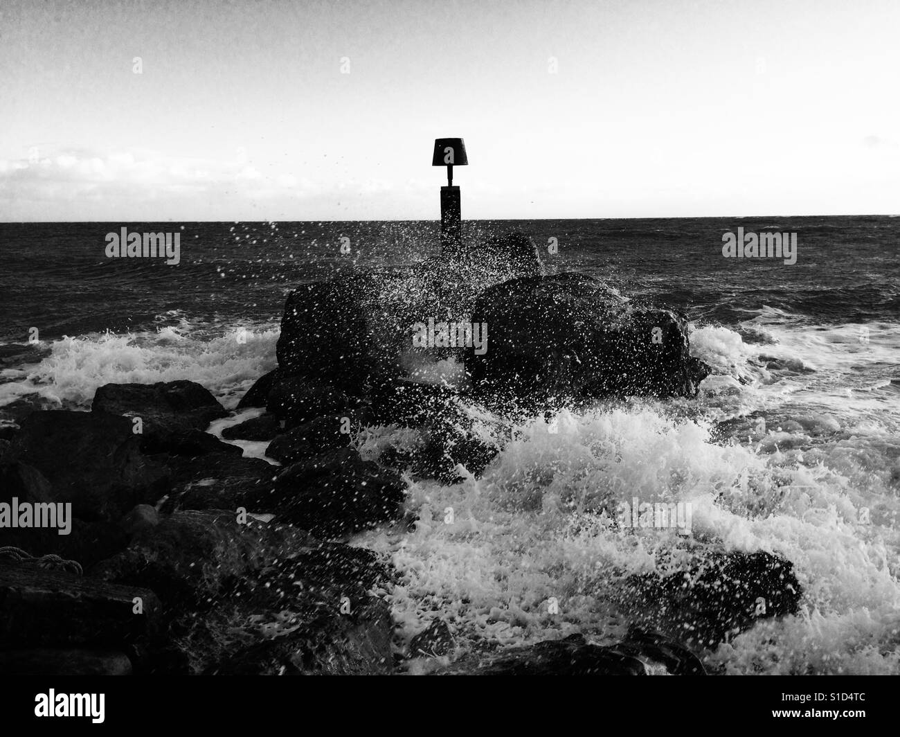 Sea breaking over rocks - Smartphone Captured Stock Image