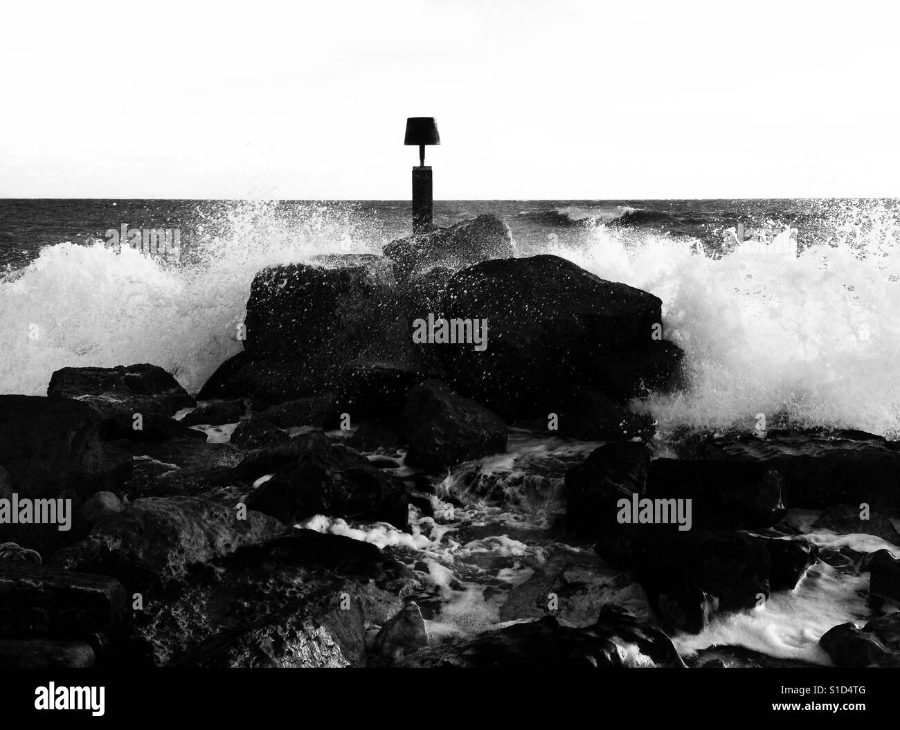 Sea breaking over rocks - Smartphone Captured Stock Image