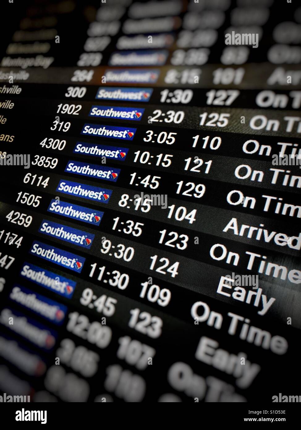 An airline arrival board featuring Southwest Airlines flights - Smartphone Captured Stock Image