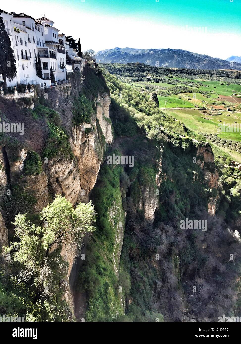 Edge of the hilltop town of Ronda, Andalucia, with views across the landscape beyond from the Puente Nuevo - Smartphone Captured Stock Image
