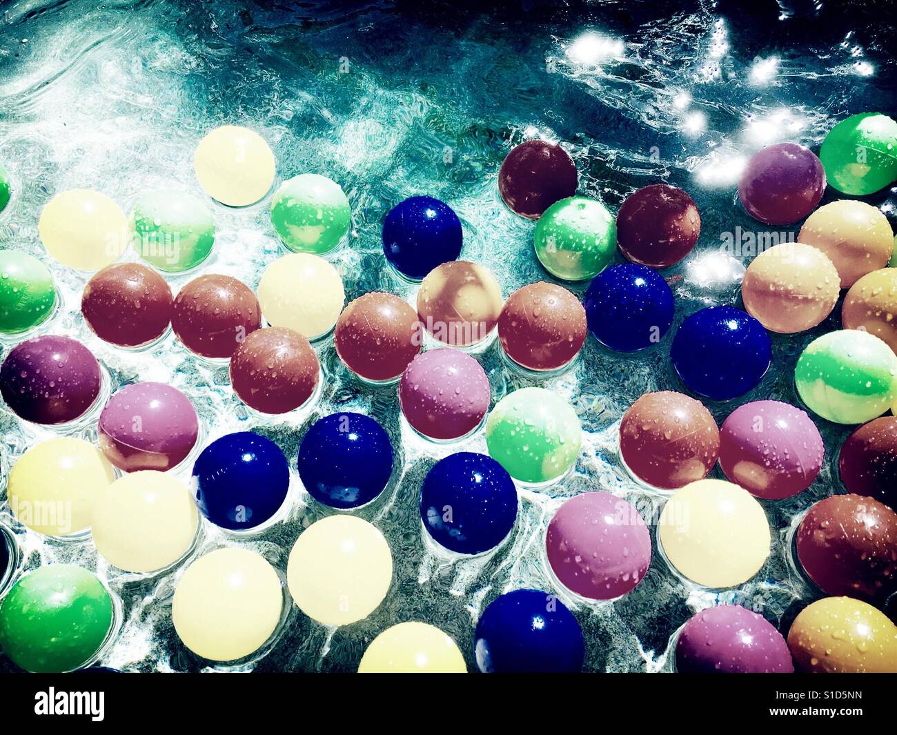 Colorful balls in water Stock Photo Alamy