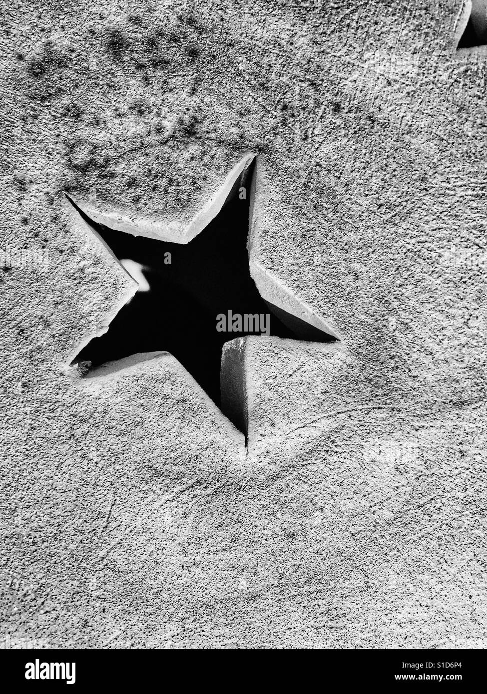 Star, carved into a ceramic pot - Smartphone Captured Stock Image
