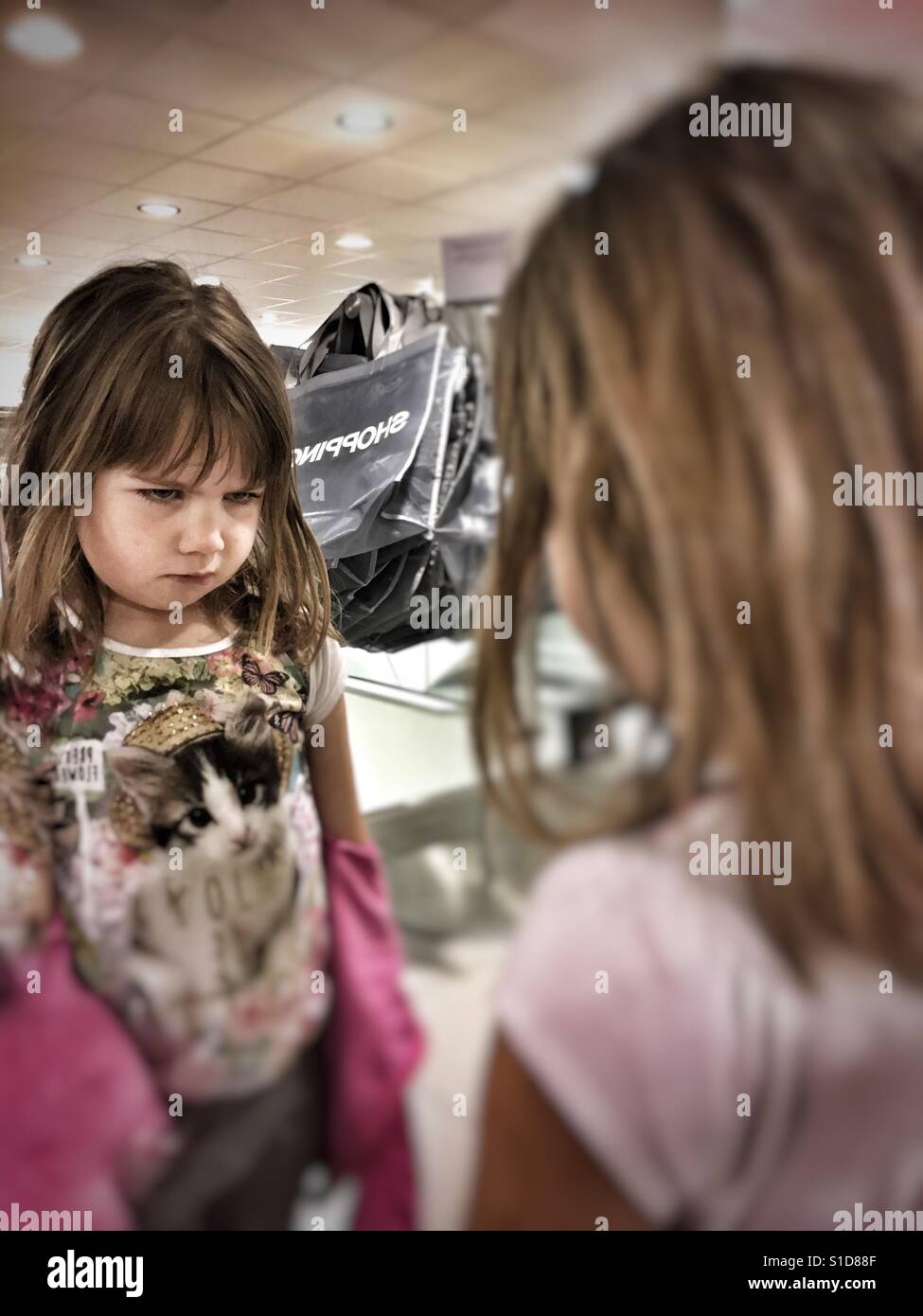 Girl in mirror Stock Photo