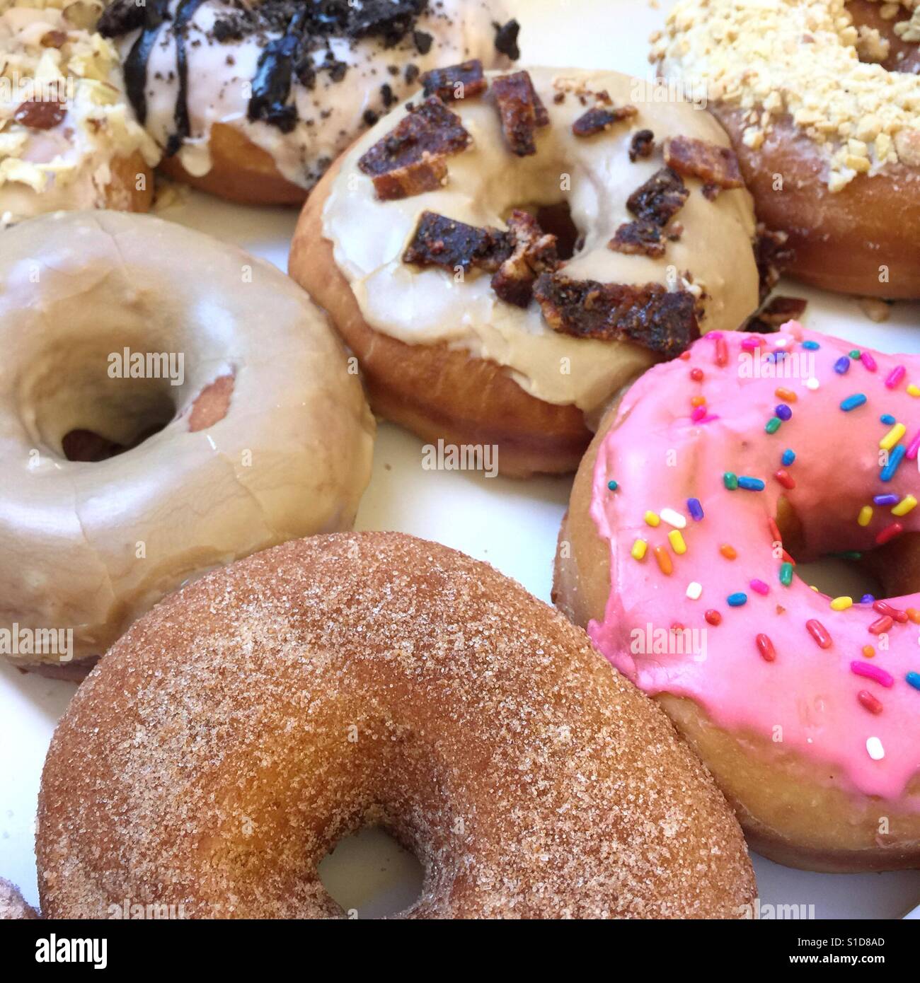 A closeup photo of colorful fancy iced donuts - Smartphone Captured Stock Image