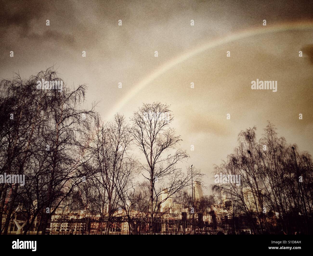 London skyline with rainbow - Smartphone Captured Stock Image