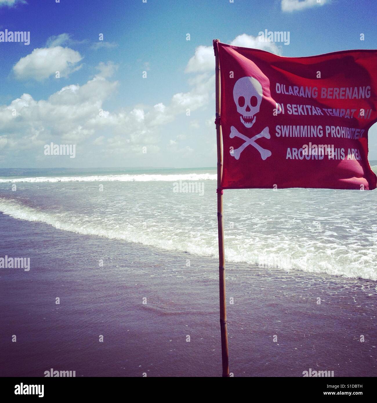 Danger zone in Bali for strong current in water. Surfers area! Stock Photo  - Alamy