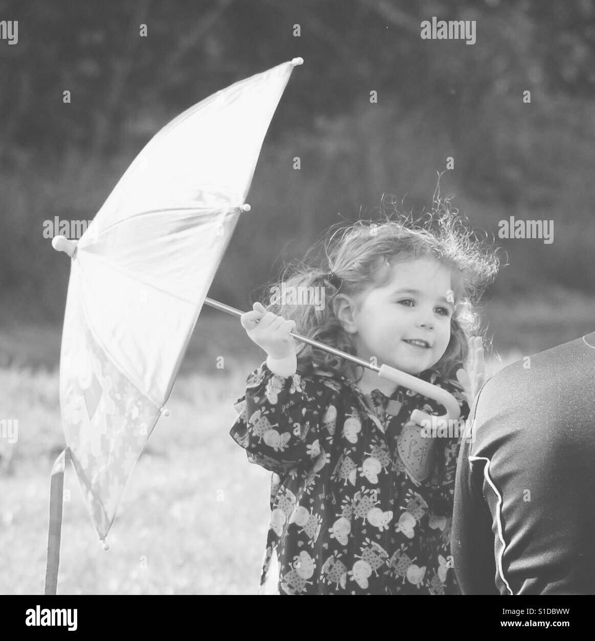 Girl holding umbrella Stock Photo