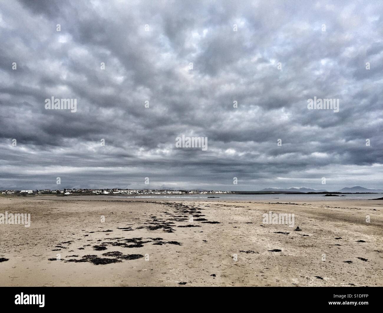 View back to beach front of Rhosneigr from Cymyran beach, Anglesey, North Wales - Smartphone Captured Stock Image