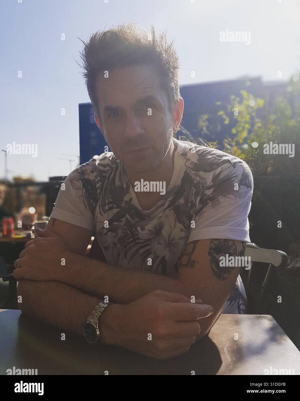 Man at table - Smartphone Captured Stock Image