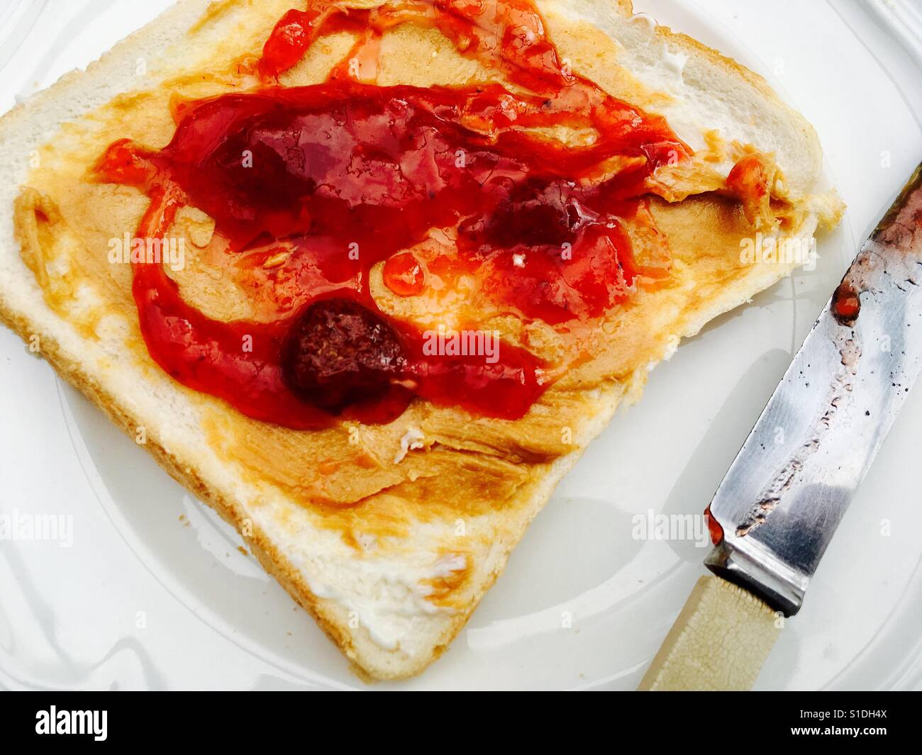 Peanut butter and strawberry jam sandwich Stock Photo Alamy