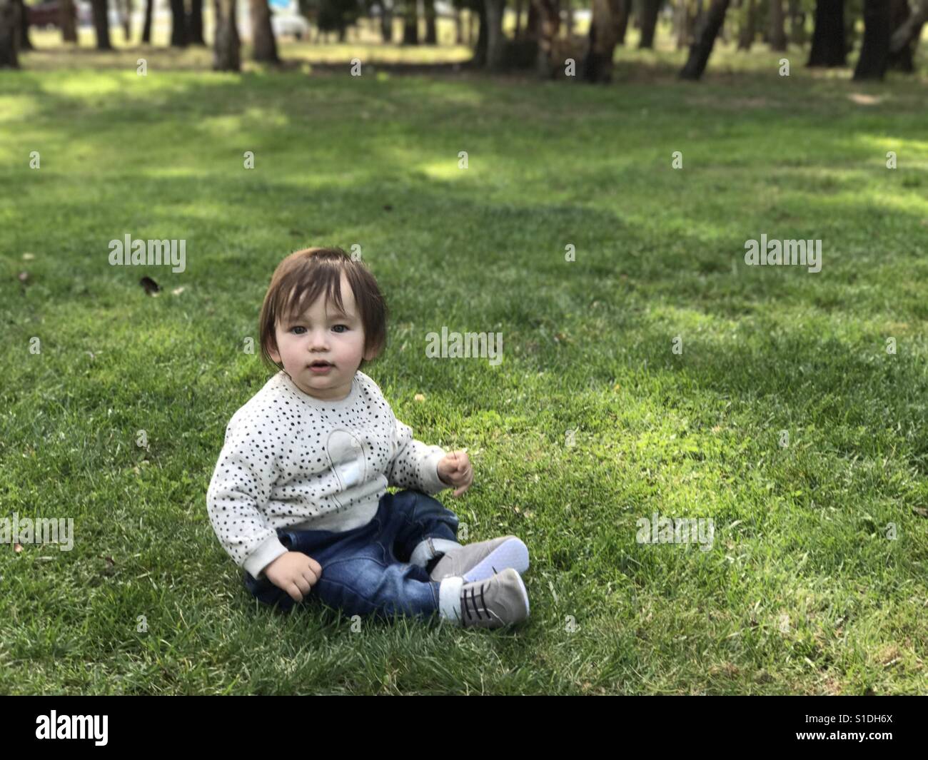 Baby on the grass Stock Photo