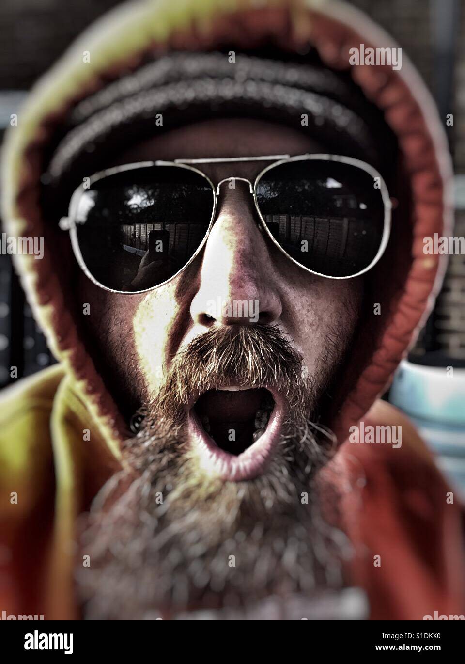 Hoodie in sunglasses Stock Photo Alamy