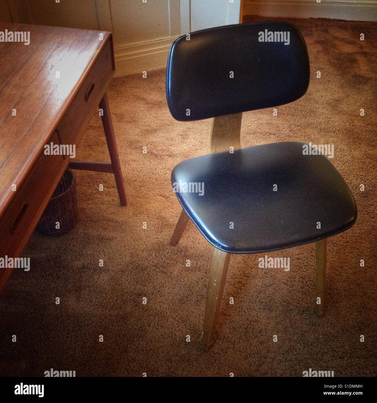 Retro chair and desk at a house for sale in Berkeley, California. - Smartphone Captured Stock Image