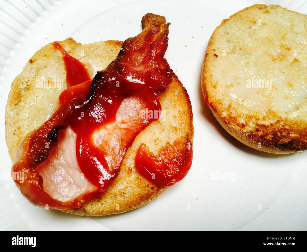 Bacon muffin with tomato ketchup Stock Photo Alamy