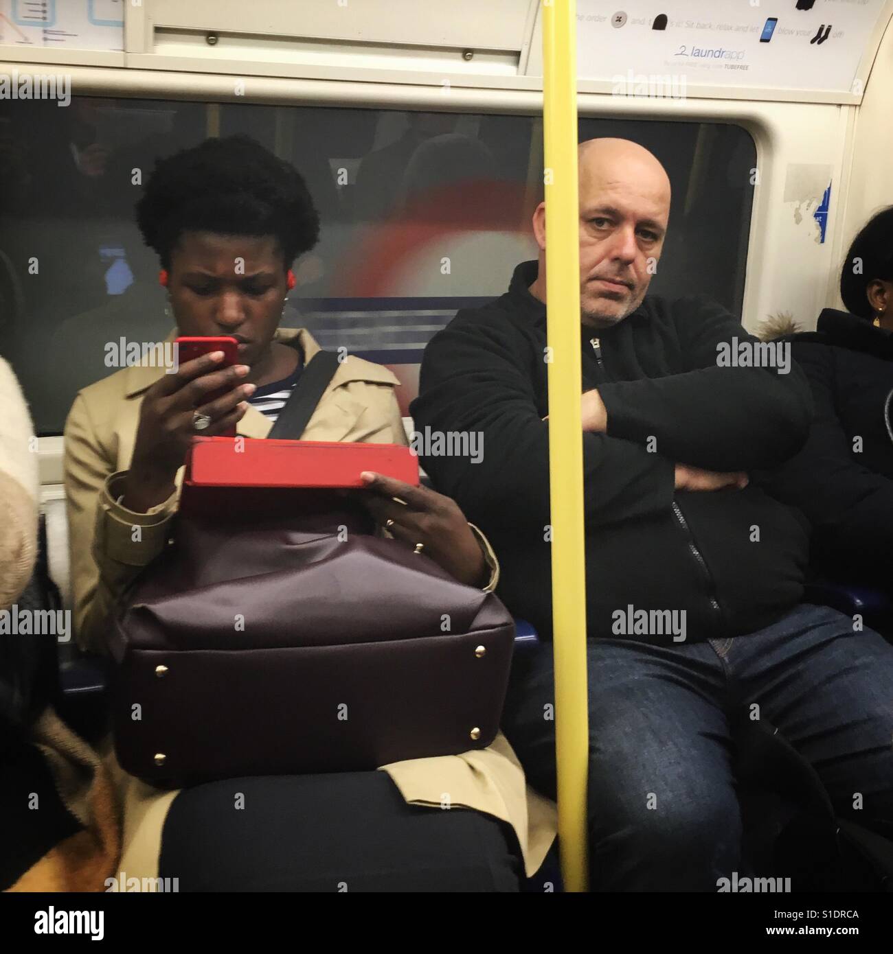 Passengers riding the London Underground Tube Central Line Stock Photo
