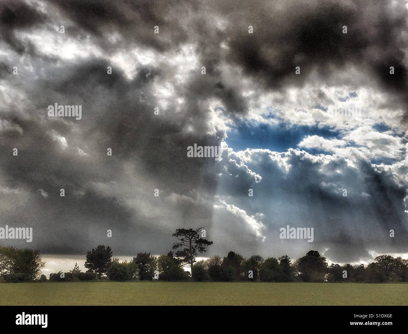 April shower clouds moving across the Suffolk countryside - Smartphone Captured Stock Image