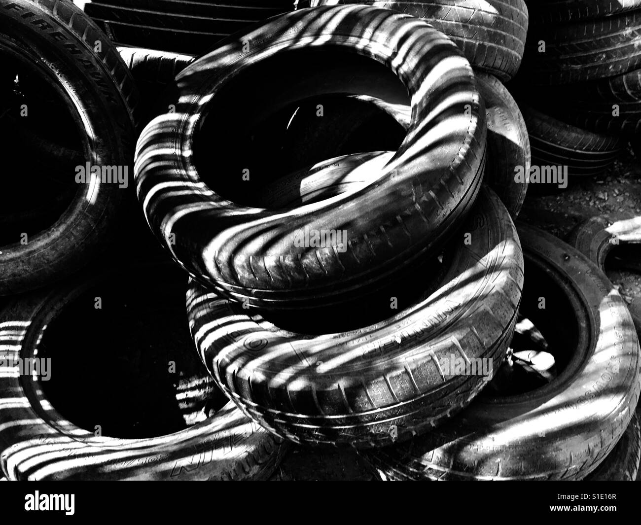 Used up tires resting in the sun - Smartphone Captured Stock Image