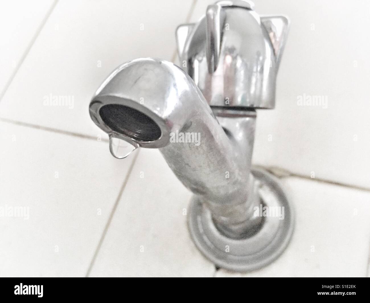 Water drop falling from a tap. - Smartphone Captured Stock Image