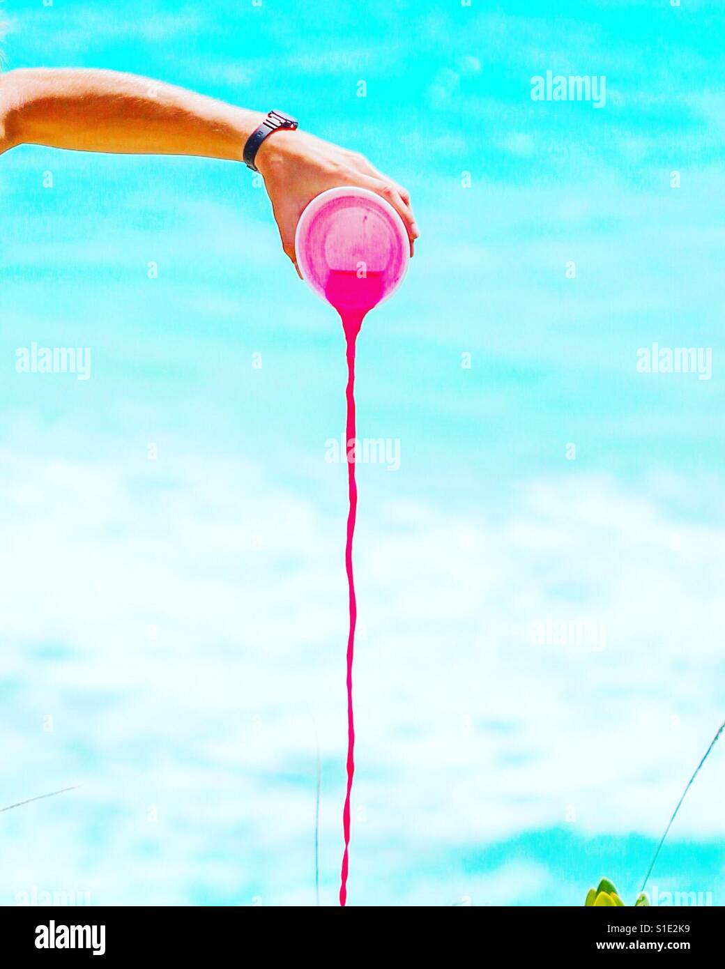 Spilling pink drink - Smartphone Captured Stock Image