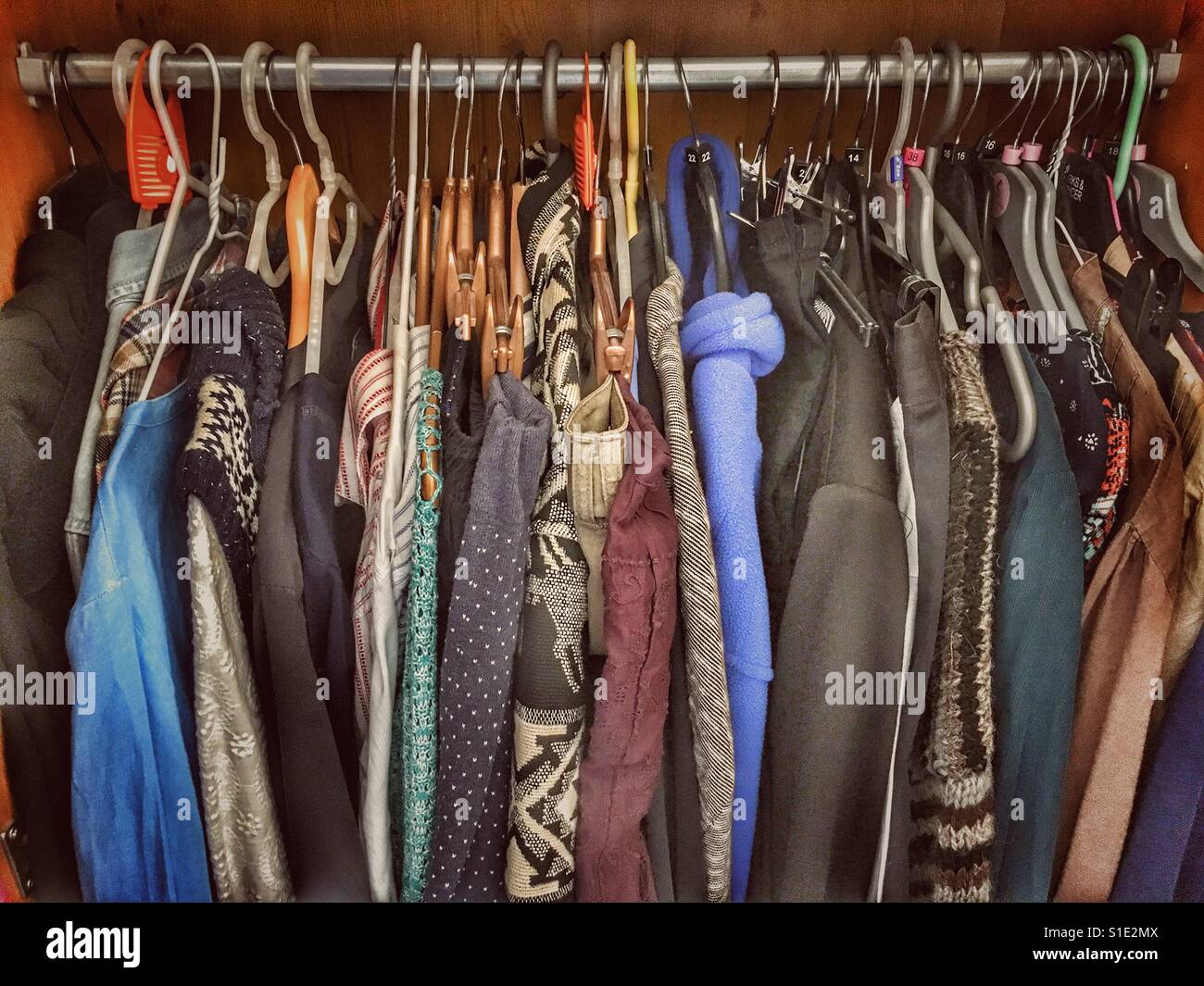 Clothes hanging in a cupboard - Smartphone Captured Stock Image