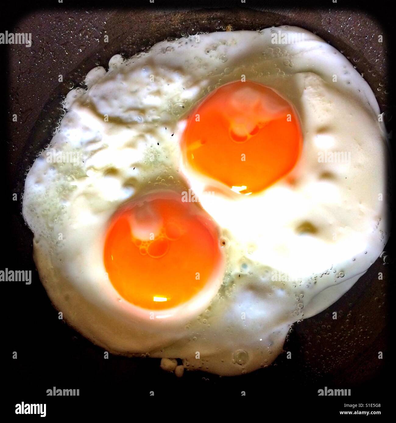 Double fried egg in frying pan - Smartphone Captured Stock Image