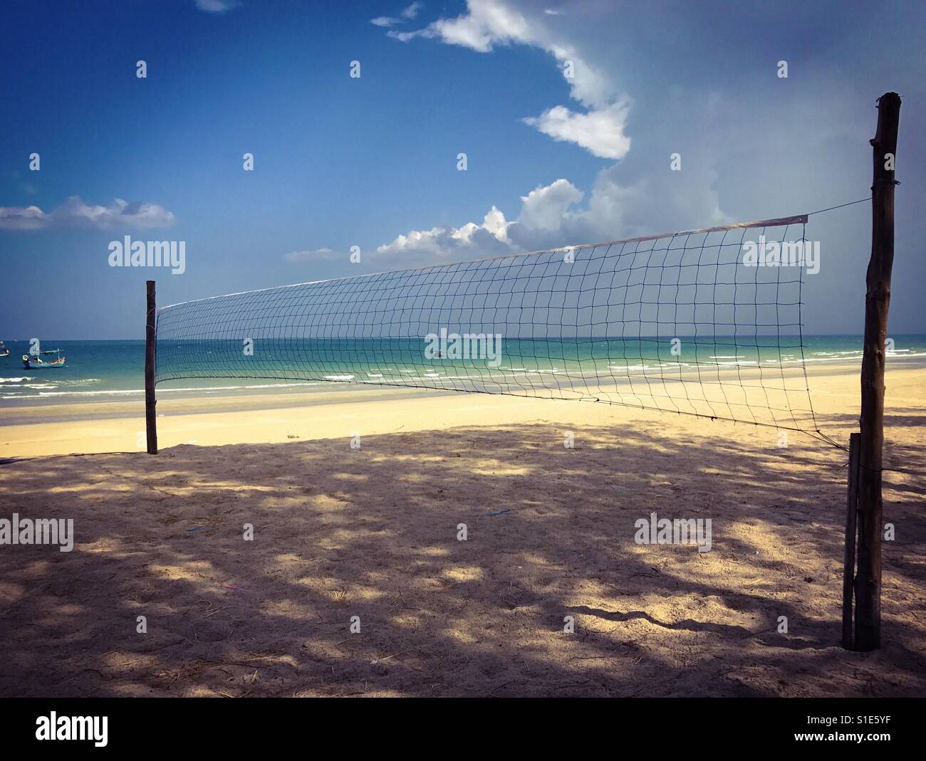 Beach volleyball net by the sea Stock Photo