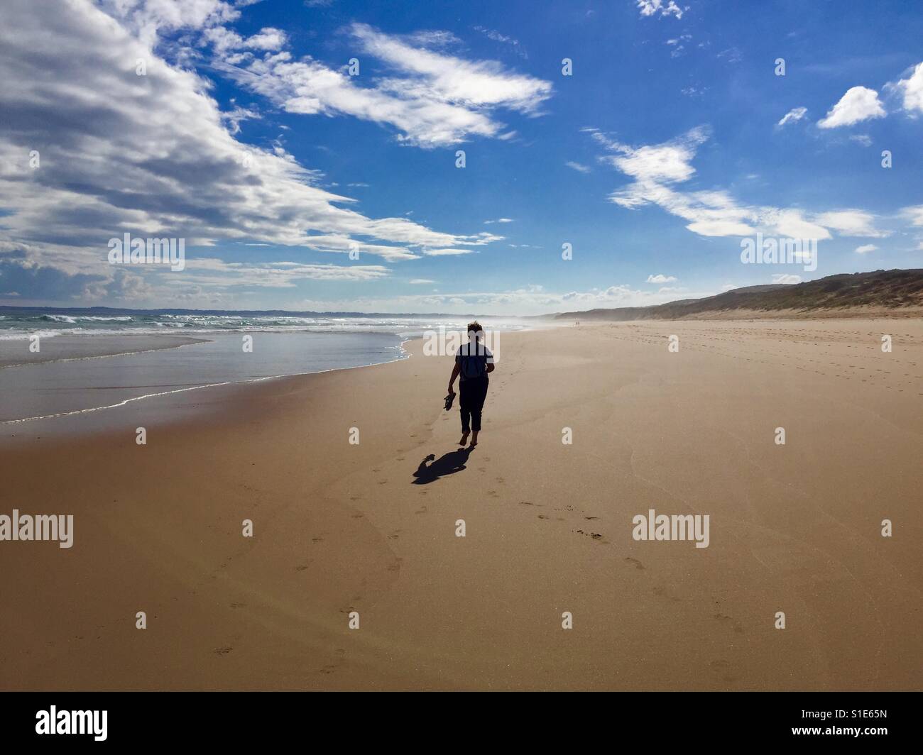 Lonely person on beach hi-res stock photography and images - Alamy