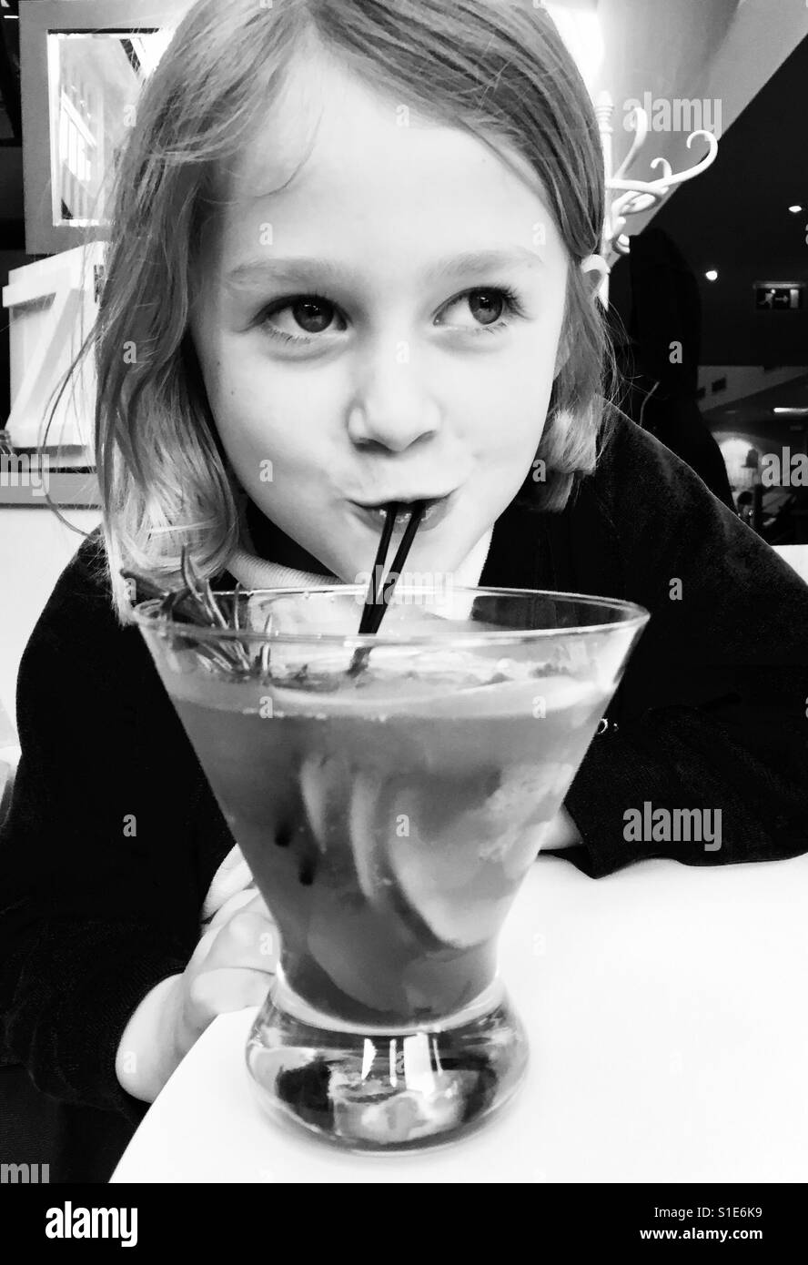 Girl sipping mums cocktail - Smartphone Captured Stock Image