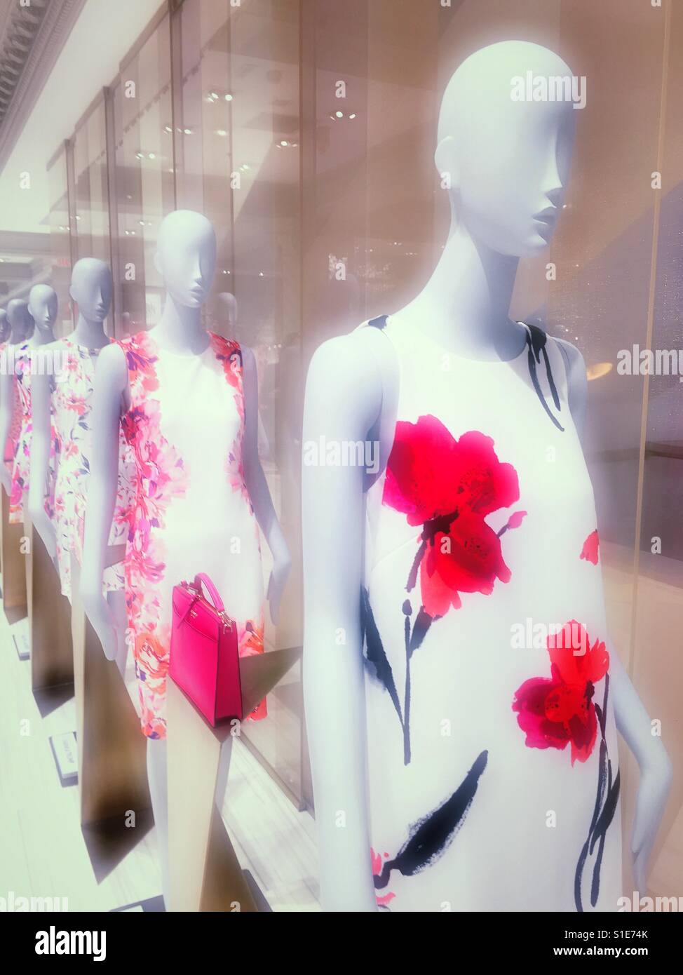 Mannequins with spring dresses at Lord and Taylor department store, NYC, USA Stock Photo