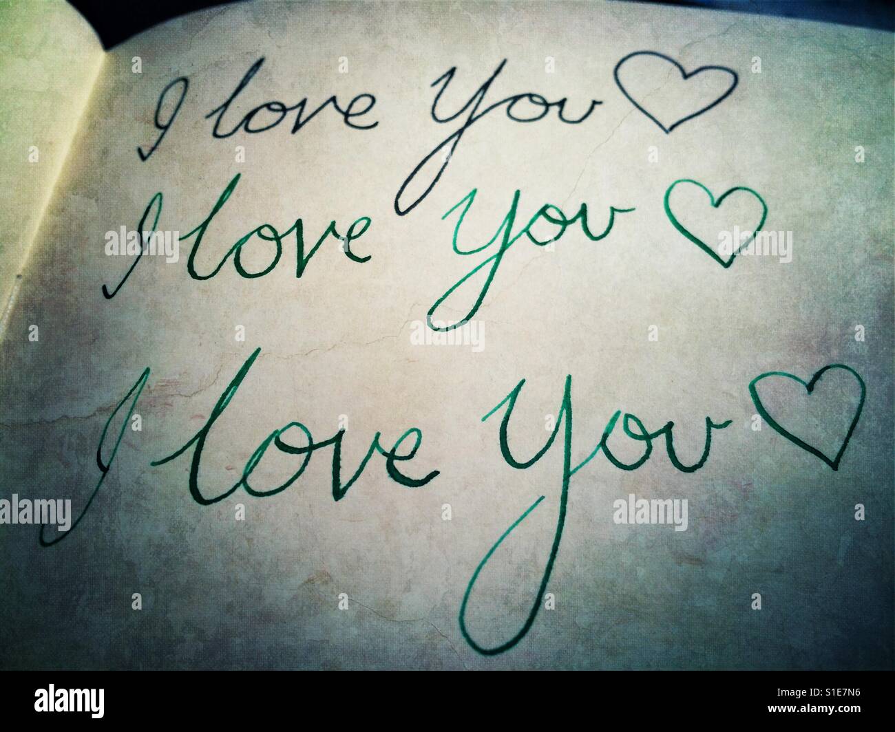 I love you written on a notebook over and over - Smartphone Captured Stock Image