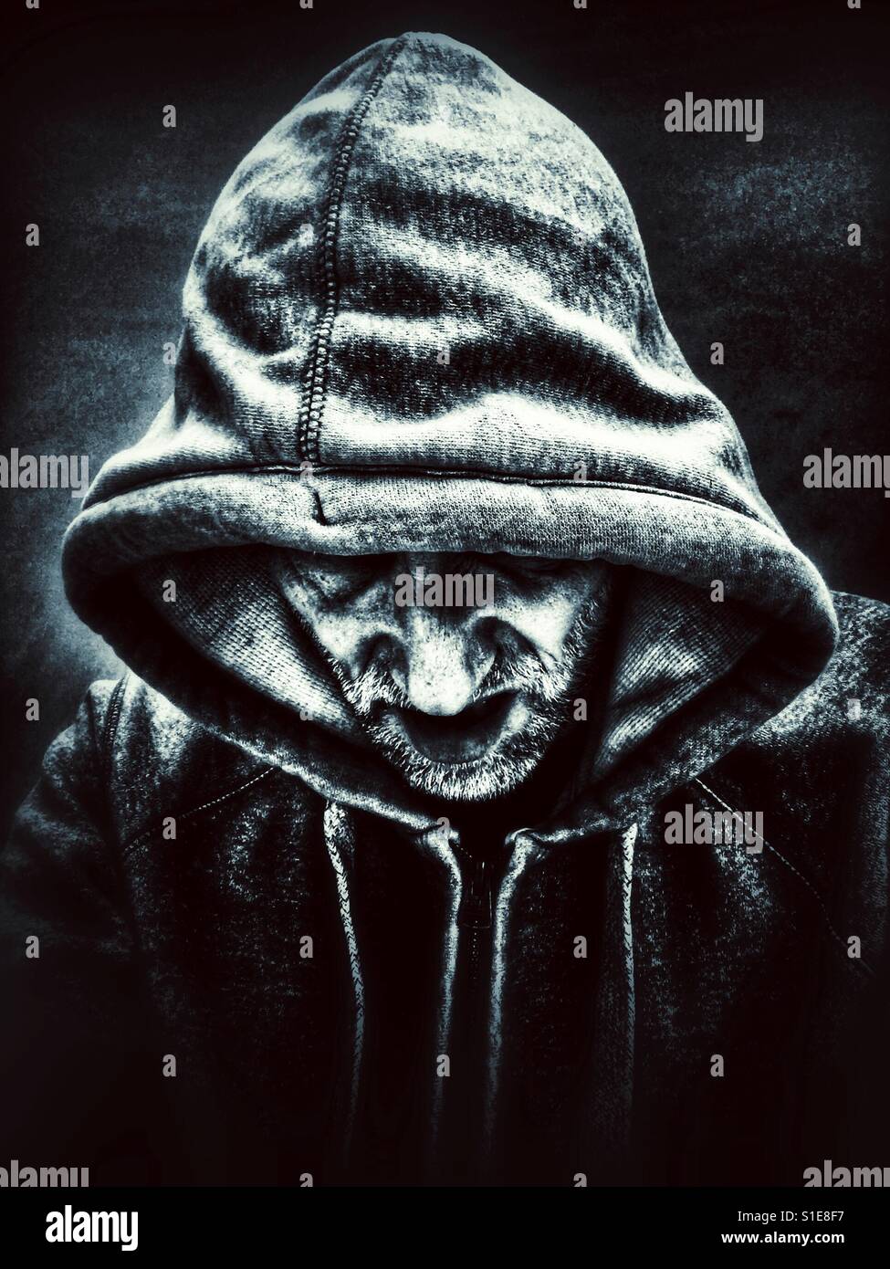 Snarling hooded man - Smartphone Captured Stock Image