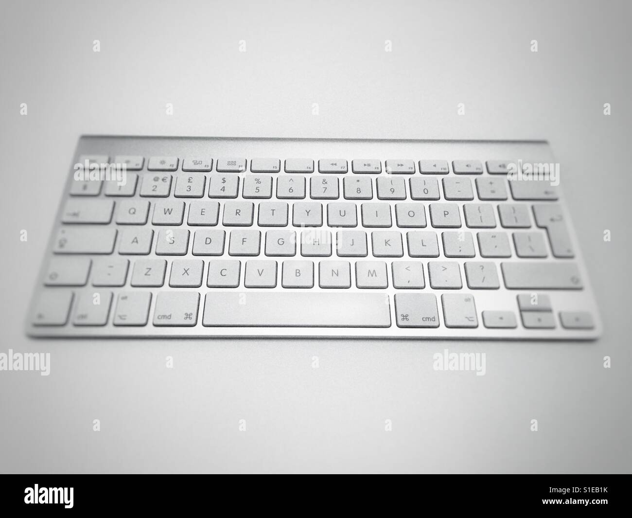 Apple wireless keyboard - Smartphone Captured Stock Image